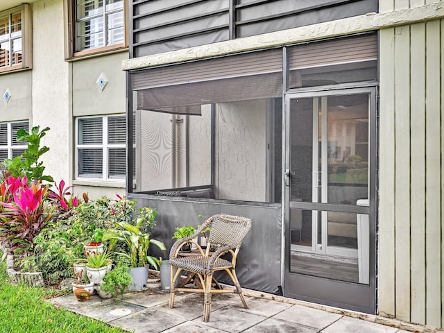 doorway to property featuring a patio