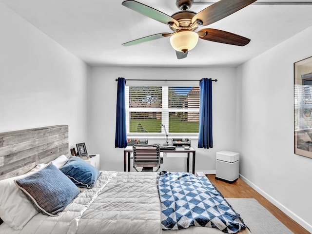 bedroom featuring ceiling fan and light wood-type flooring