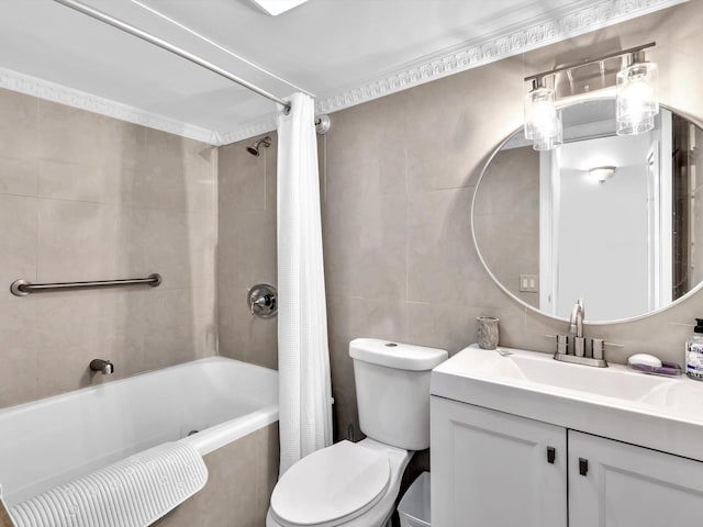 full bathroom with tile walls, shower / bath combo, toilet, and vanity