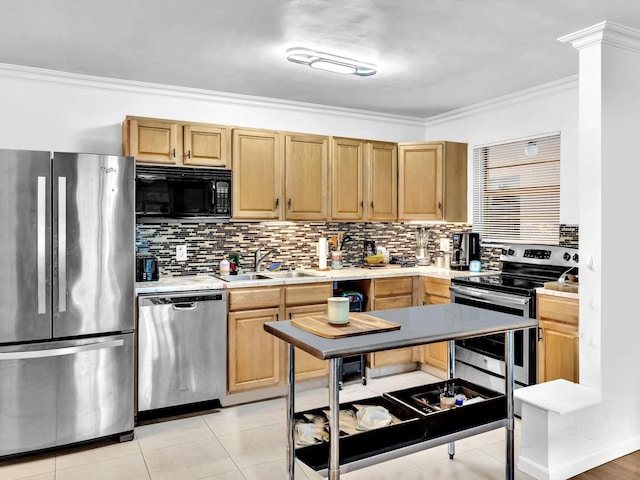 kitchen featuring sink, light tile floors, crown molding, stainless steel appliances, and tasteful backsplash