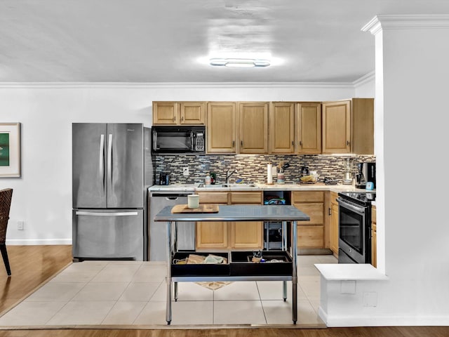 kitchen with backsplash, light tile flooring, appliances with stainless steel finishes, sink, and crown molding