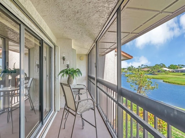 balcony featuring a water view