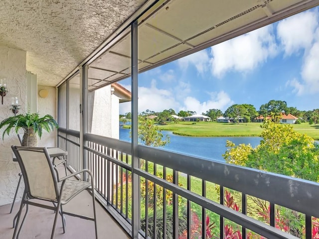 balcony featuring a water view