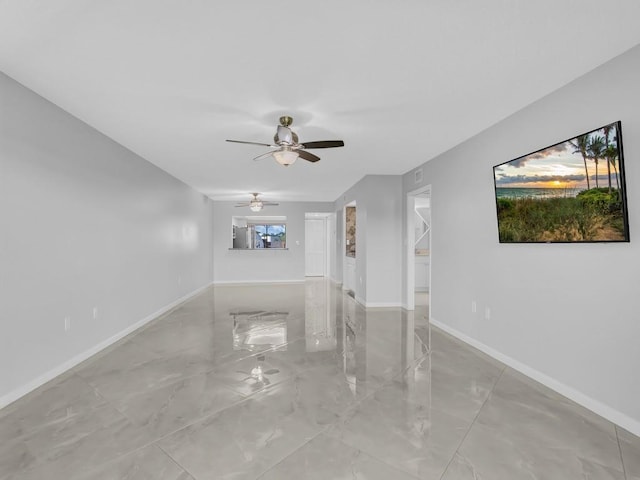 unfurnished room with ceiling fan