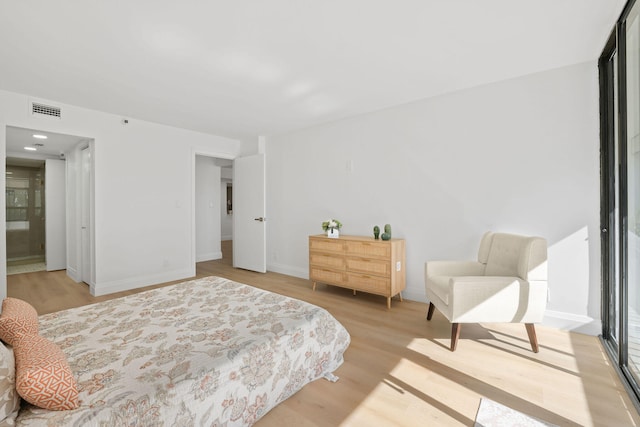 bedroom with light wood-type flooring