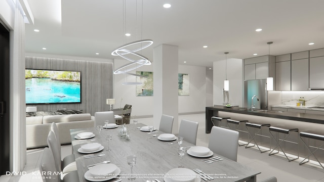 tiled dining space with an inviting chandelier and sink