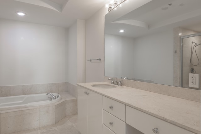 bathroom featuring tile patterned flooring, vanity, and independent shower and bath