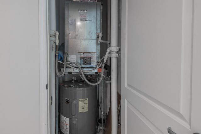 utility room featuring water heater