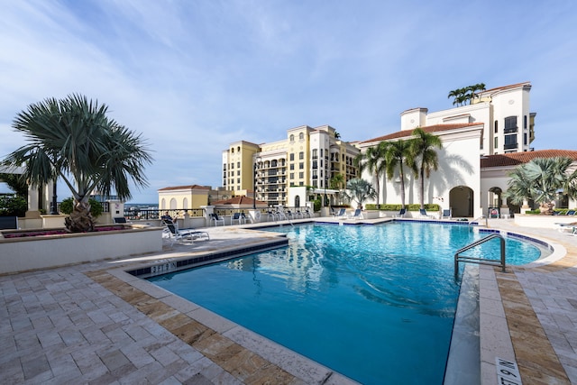 view of swimming pool featuring a patio area