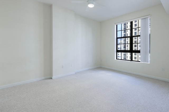 carpeted empty room with ceiling fan