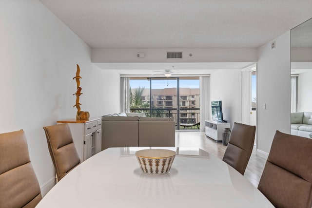 dining space with ceiling fan