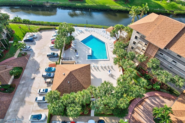 birds eye view of property with a water view