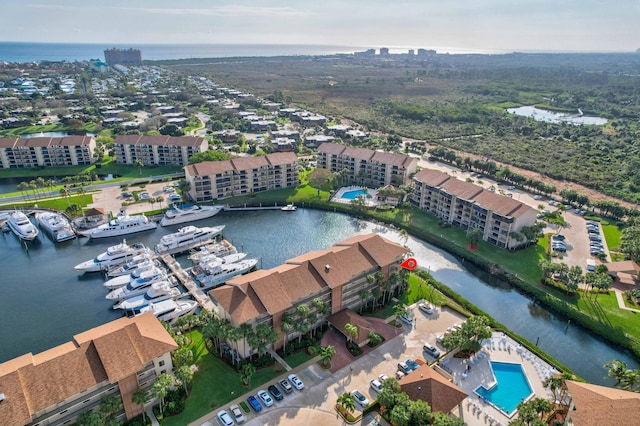 birds eye view of property featuring a water view