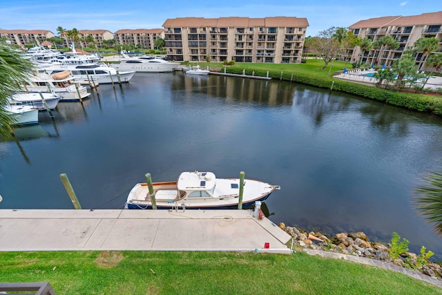 dock area featuring a water view and a yard