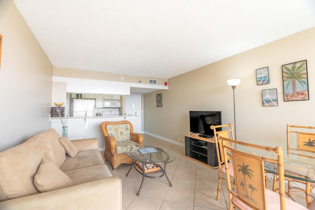 living room featuring light tile flooring