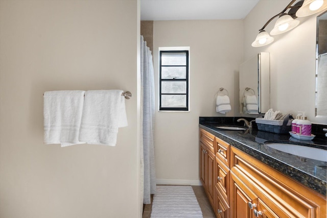 bathroom featuring double sink vanity and tile flooring