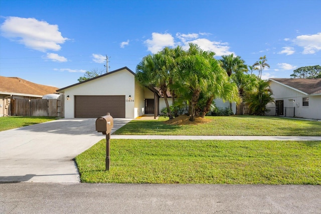 ranch-style house with a front yard and a garage