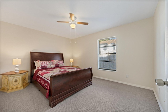 bedroom featuring light colored carpet and ceiling fan