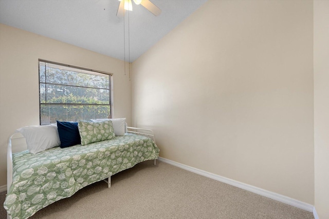 bedroom with light colored carpet, ceiling fan, and lofted ceiling