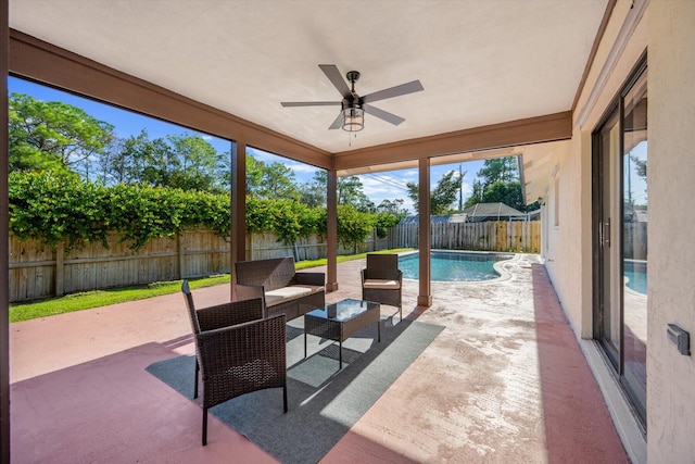 view of patio with a fenced in pool and ceiling fan