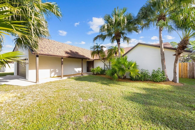 exterior space with a lawn and a garage