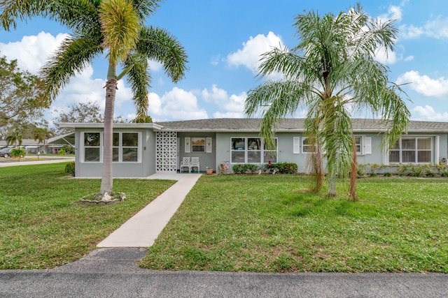 ranch-style home with a front yard