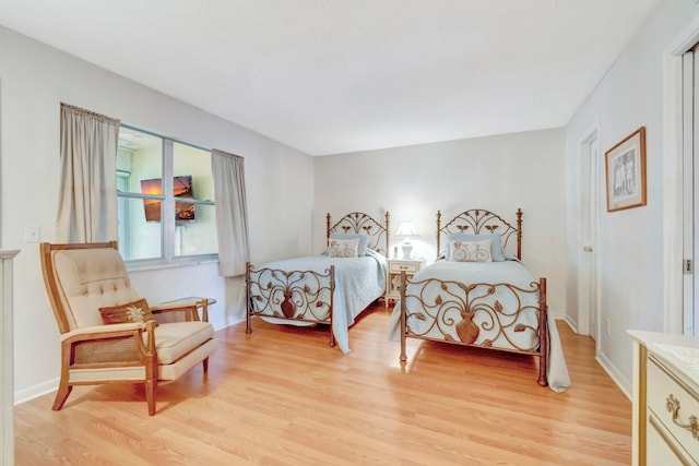 bedroom with light wood-type flooring