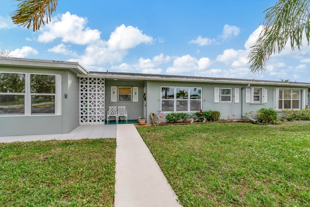 ranch-style house with a front yard