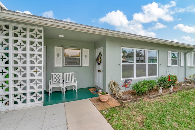 entrance to property with a patio area