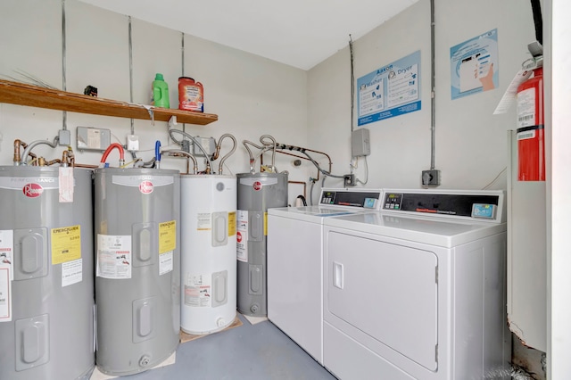 laundry area featuring electric dryer hookup, electric water heater, and independent washer and dryer