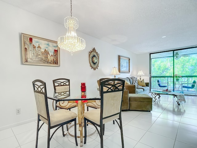 tiled dining space featuring a chandelier and a textured ceiling