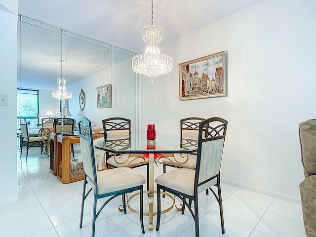 dining room with light tile floors, a notable chandelier, and a textured ceiling