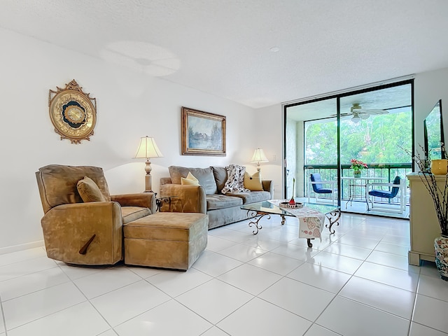 living room with floor to ceiling windows, a textured ceiling, light tile flooring, and ceiling fan