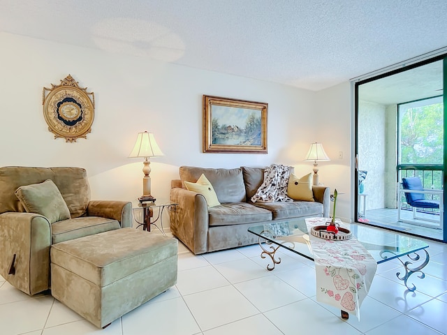 living room with a wall of windows, light tile floors, and a textured ceiling