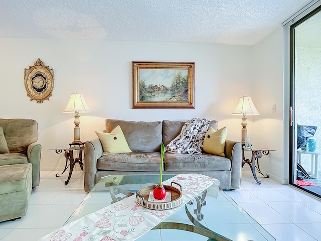 tiled living room featuring a textured ceiling