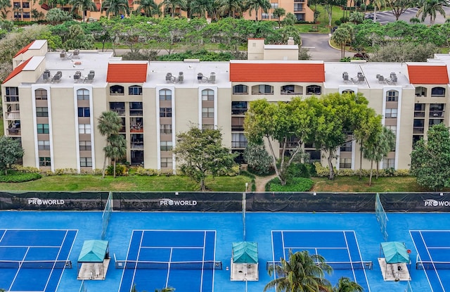 view of pool with tennis court