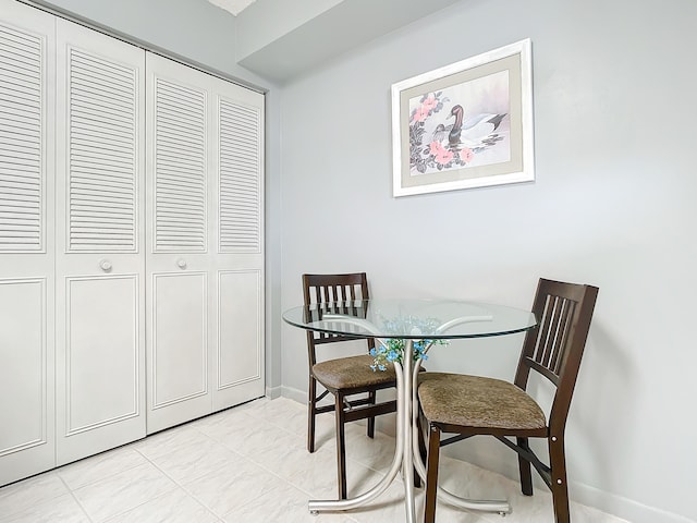 dining room with light tile floors