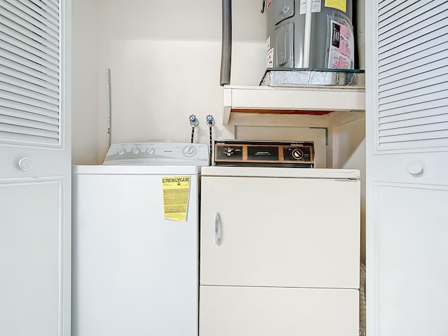 laundry room featuring washing machine and clothes dryer