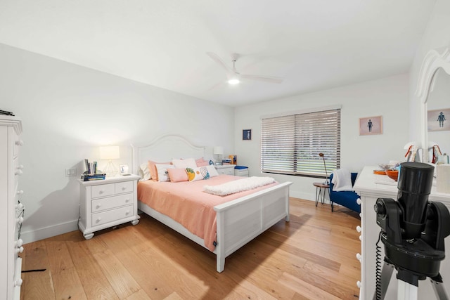 bedroom with light wood-type flooring and ceiling fan