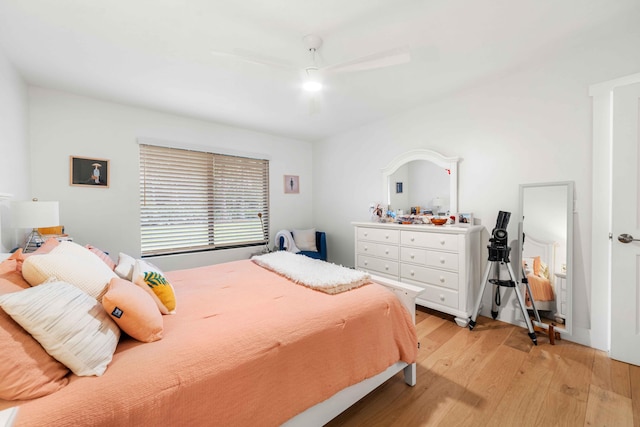 bedroom with light wood-type flooring and ceiling fan