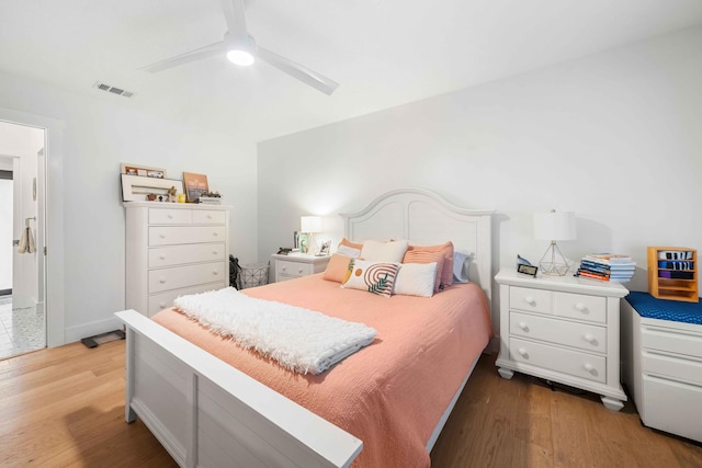 bedroom with ceiling fan and hardwood / wood-style floors