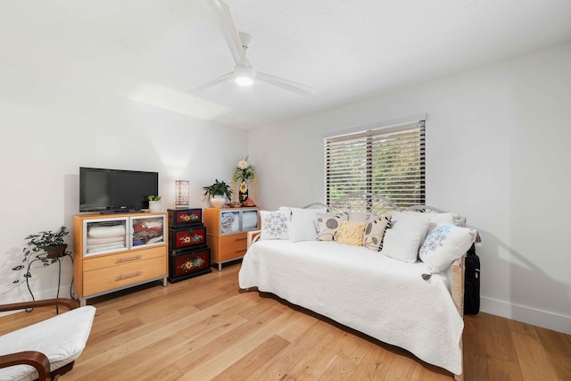 bedroom featuring light wood-type flooring and ceiling fan