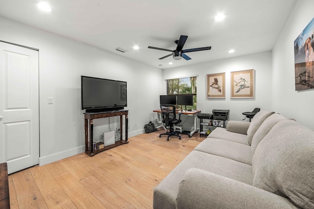 home office featuring hardwood / wood-style floors and ceiling fan