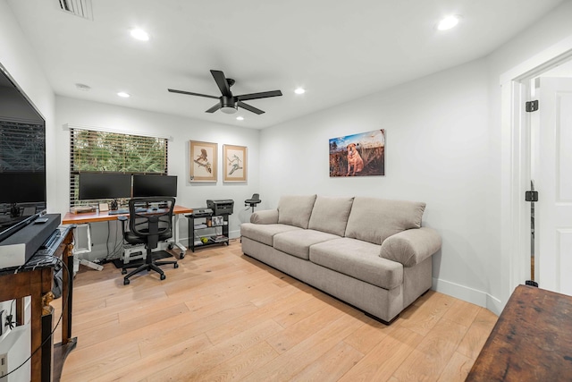 office space featuring ceiling fan and light hardwood / wood-style flooring