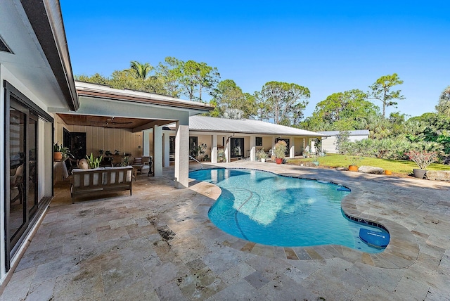 view of pool featuring outdoor lounge area and a patio