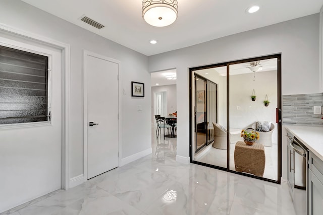 kitchen with tasteful backsplash, ceiling fan, light tile floors, and dishwasher