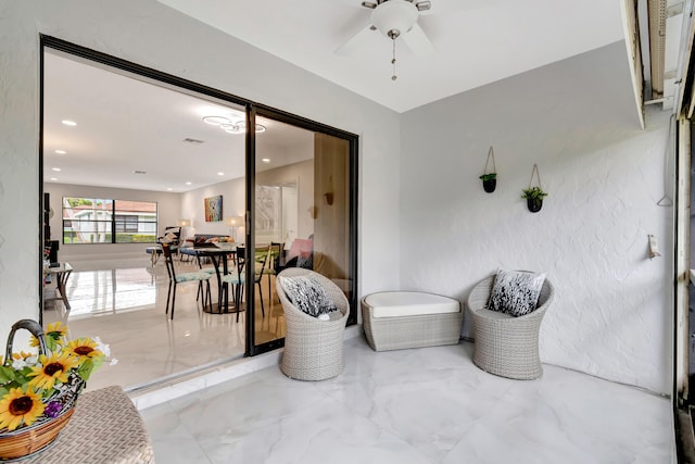 interior space featuring ceiling fan