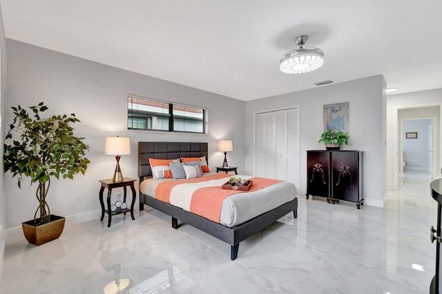 tiled bedroom with a closet