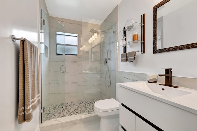 bathroom with a shower with door, large vanity, and toilet