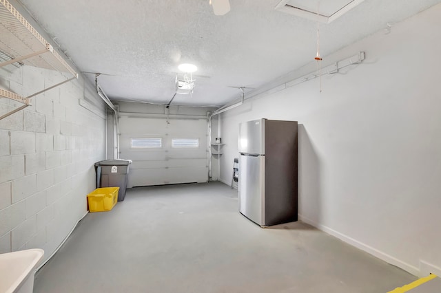 garage featuring stainless steel refrigerator